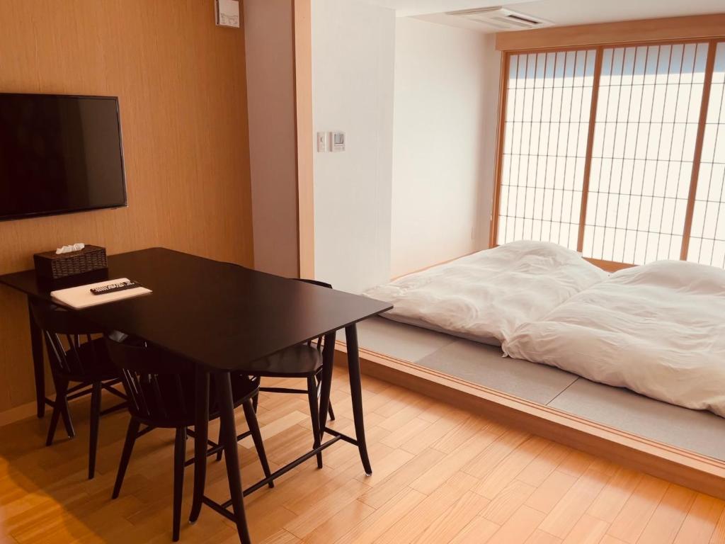 Postel nebo postele na pokoji v ubytování Nplus Tokyo Akihabara Premium