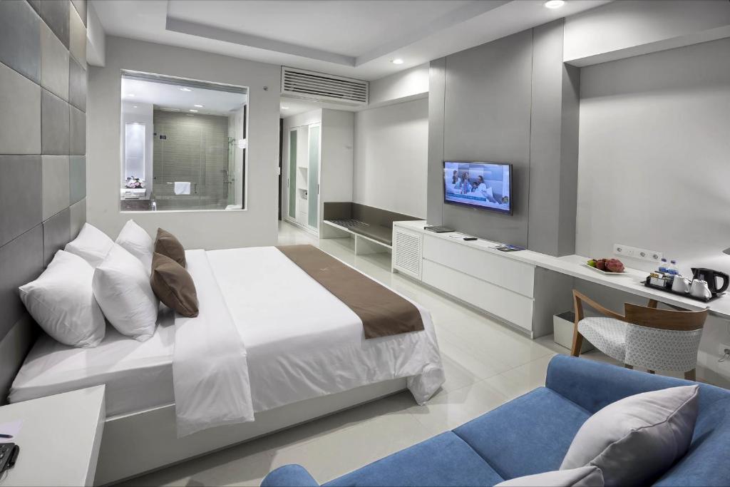 A bed or beds in a room at R Hotel Rancamaya