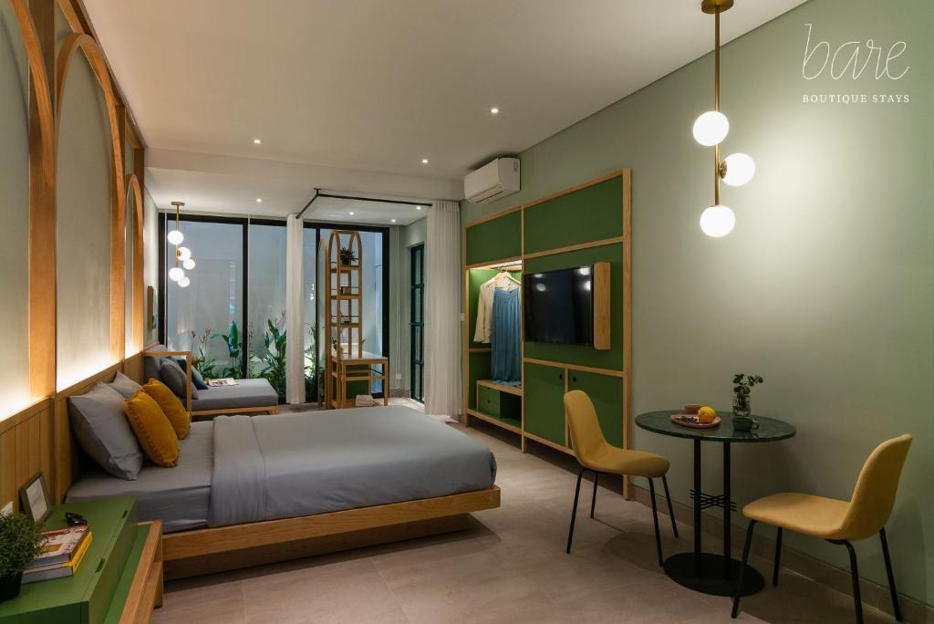 Giường trong phòng chung tại Bare Han - Bare Boutique Stays