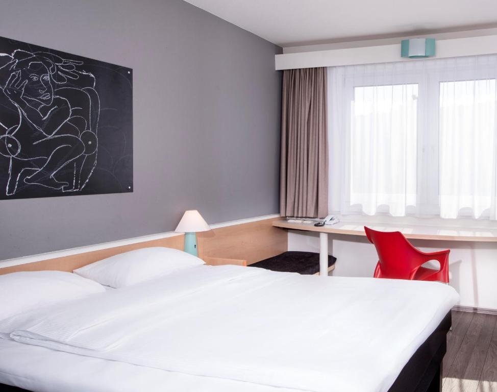 Postel nebo postele na pokoji v ubytování ibis Berlin City Nord