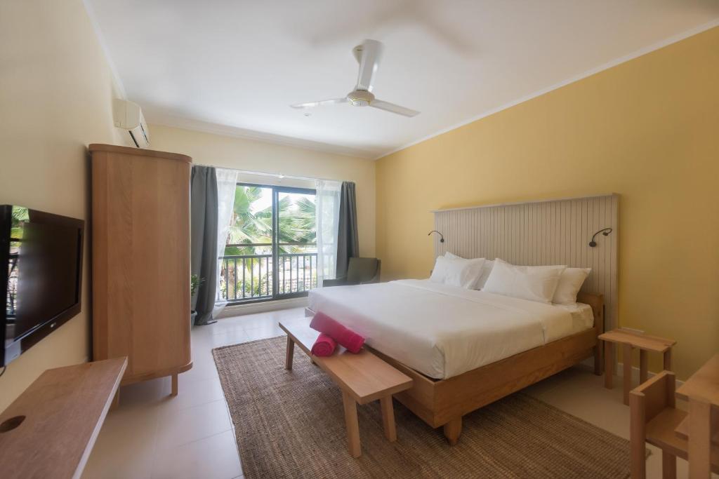 Postel nebo postele na pokoji v ubytování Residence Praslinoise