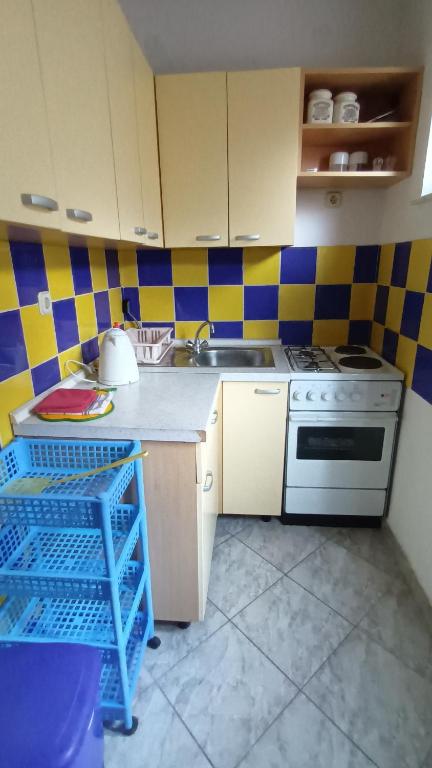 Kuchyň nebo kuchyňský kout v ubytování Marijan Martinović Apartments