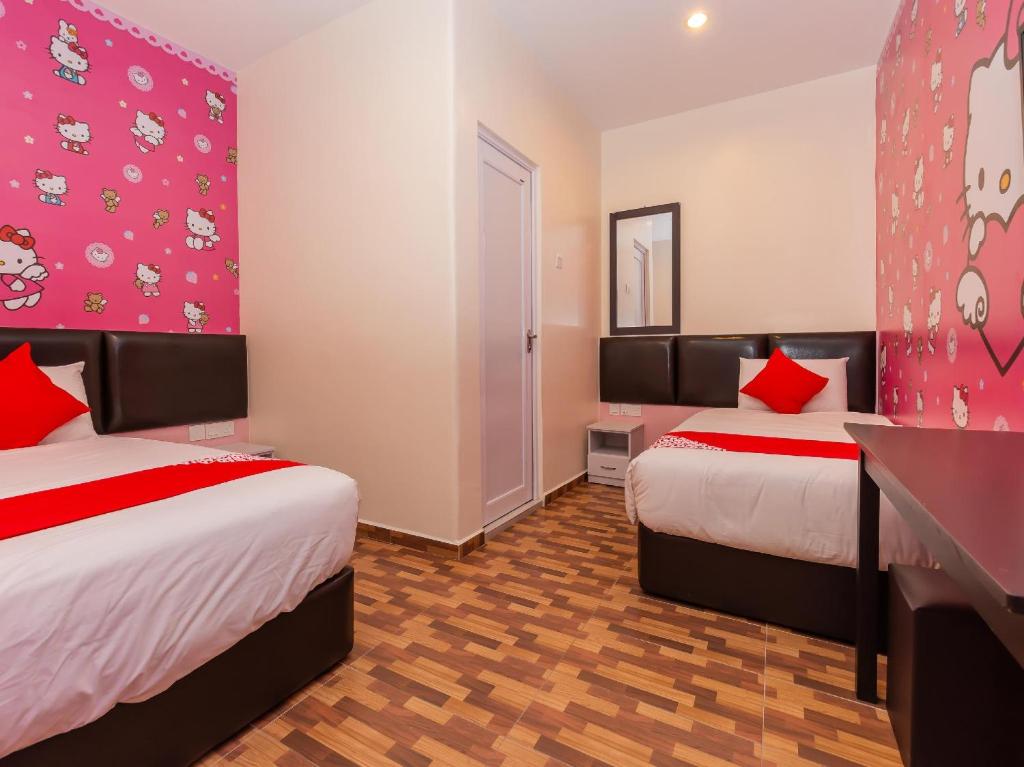 Postel nebo postele na pokoji v ubytování Gold City Hotel