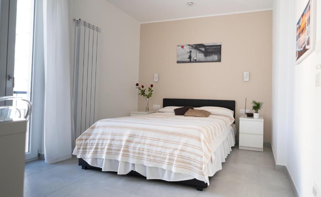 A bed or beds in a room at Mamuccia Rooms