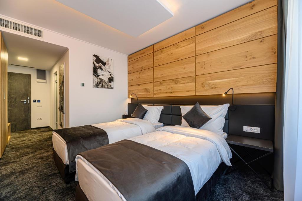 Postel nebo postele na pokoji v ubytování B THE HOTEL