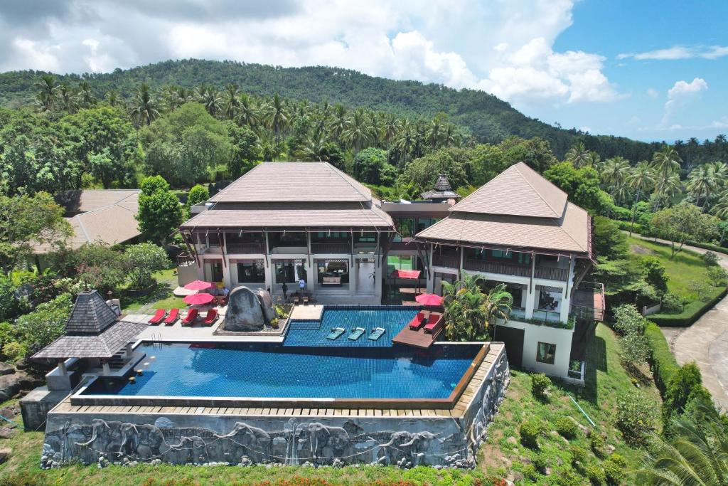 an aerial view of a house with a swimming pool at Samui Ridgeway Villa - Private Retreat with Panoramic Sea Views in Koh Samui