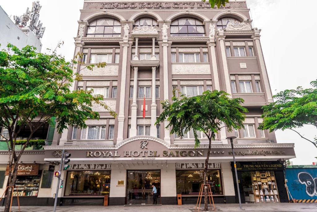 a building on the corner of a street at Royal Hotel Saigon in Ho Chi Minh City