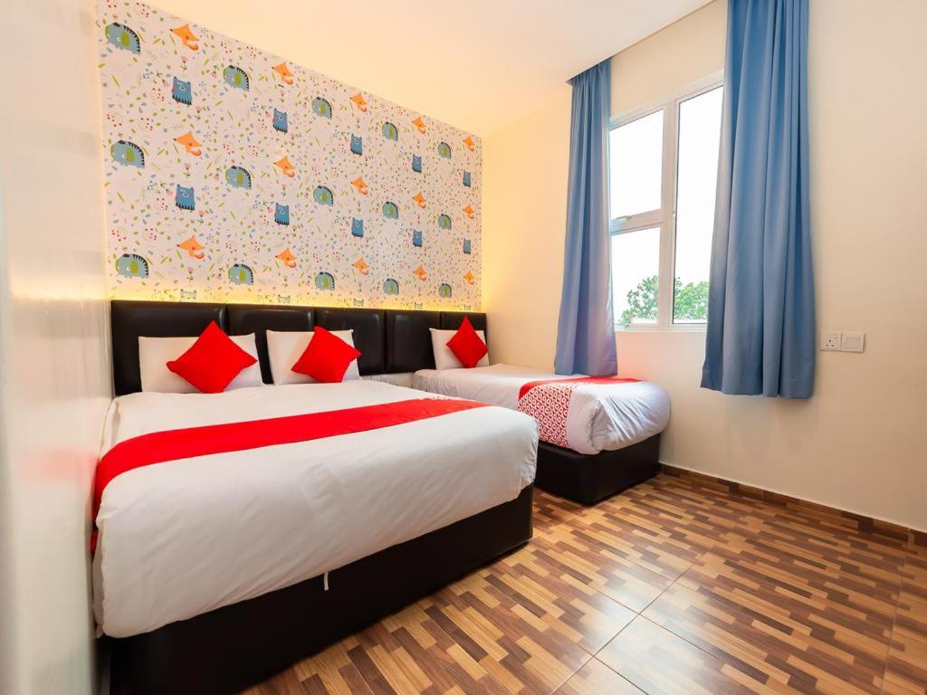 Postel nebo postele na pokoji v ubytování Gold City Hotel