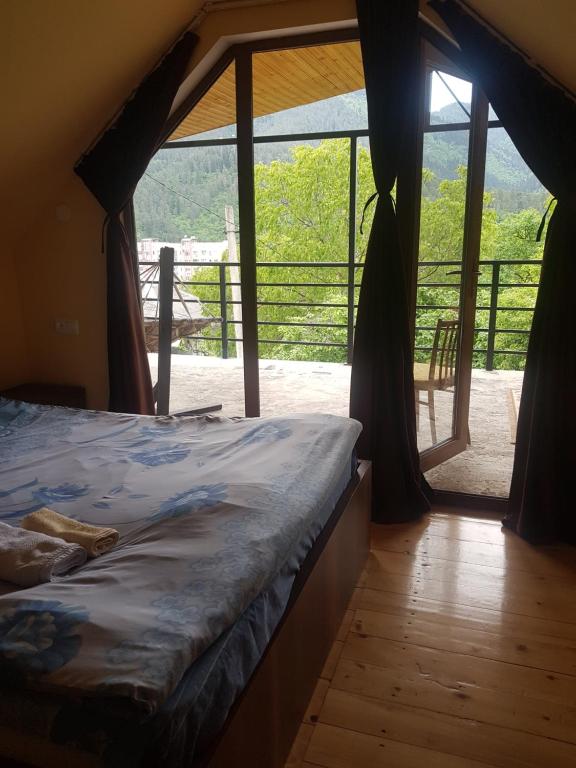 Llit o llits en una habitació de Guest House Sando