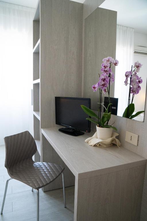 TV a/nebo společenská místnost v ubytování Hotel Dafne
