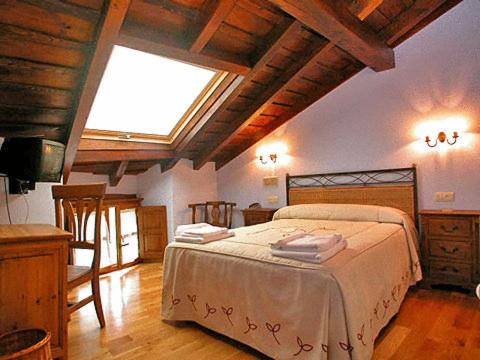 Postel nebo postele na pokoji v ubytování La Casona De Baró