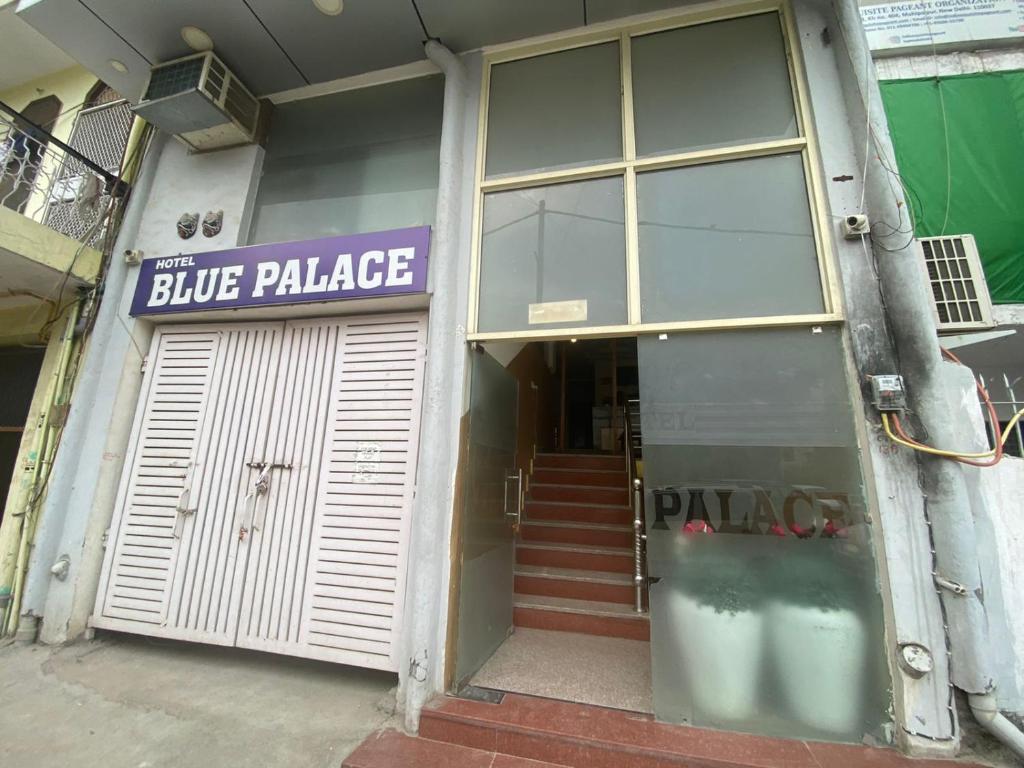 a building with a blue palace sign on the door at Hotel Blue Palace By WB Inn in New Delhi