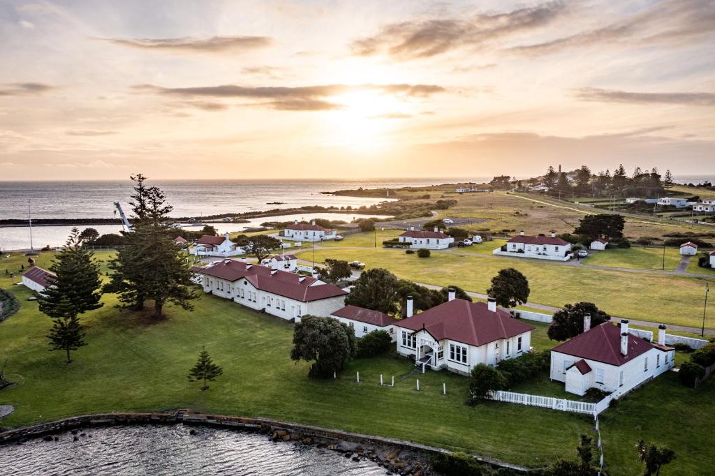 an aerial view of a small town next to the ocean at Low Head Pilot Station in Low Head