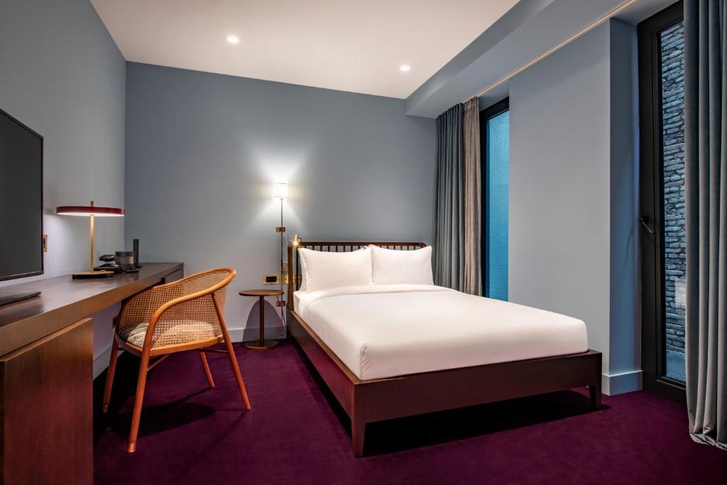 Postel nebo postele na pokoji v ubytování Bazzar Boutique Hotel