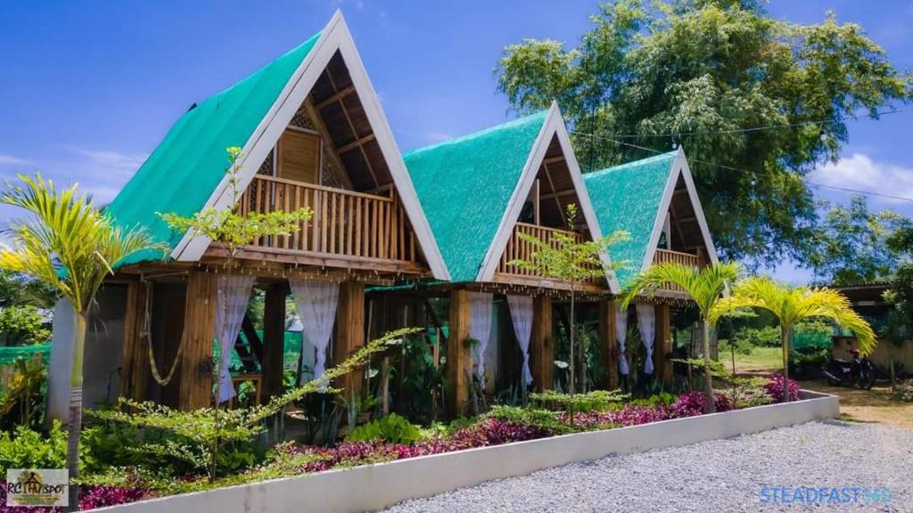 a house with a green roof at RC Hutspot Tourist Inn in San Francisco