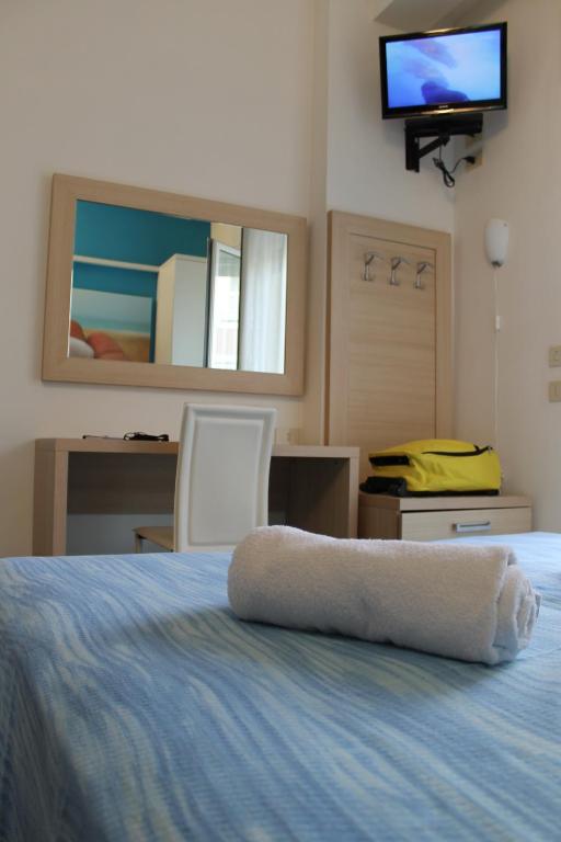 Postel nebo postele na pokoji v ubytování Hotel Esperia