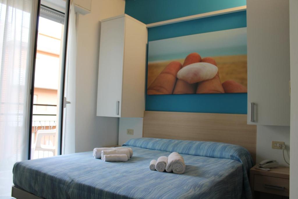 Postel nebo postele na pokoji v ubytování Hotel Esperia