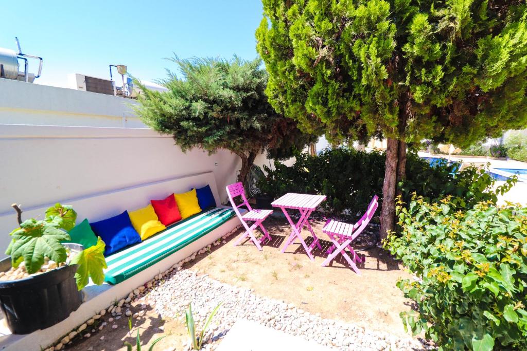 A garden outside La Brezza Suite & Hotel