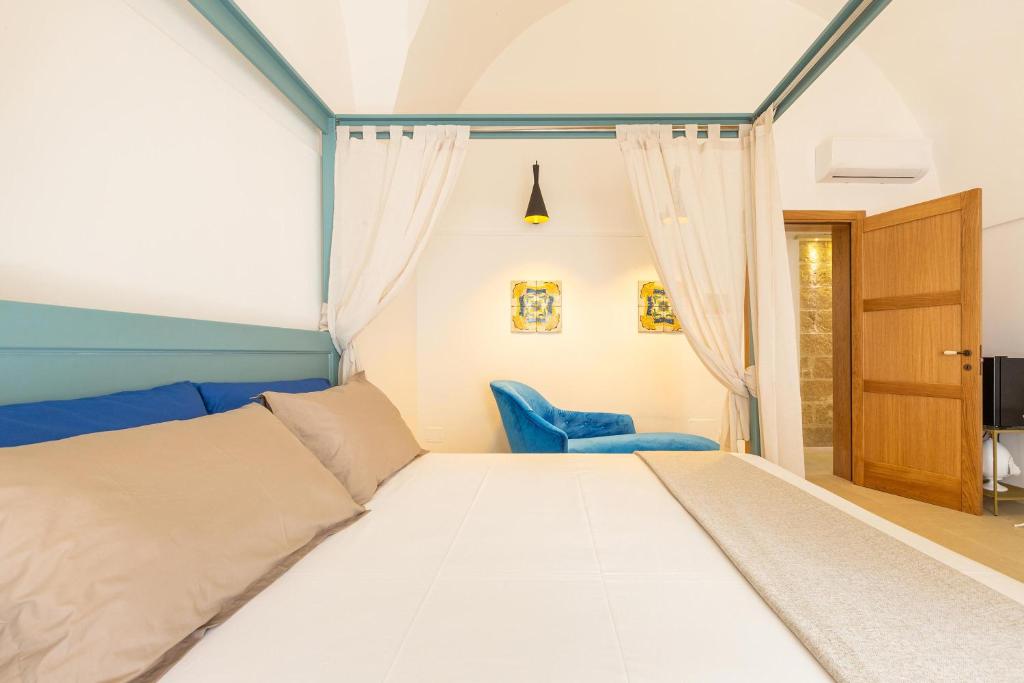 Postel nebo postele na pokoji v ubytování Le Mule Suite and Rooms - Specchia