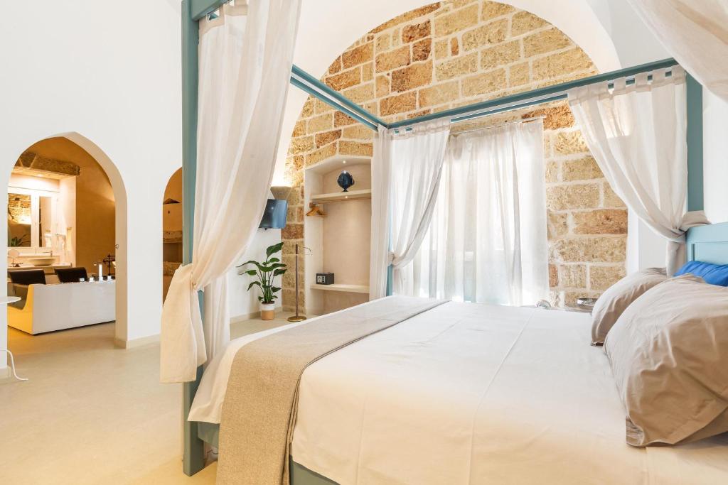Postel nebo postele na pokoji v ubytování Le Mule Suite and Rooms - Specchia
