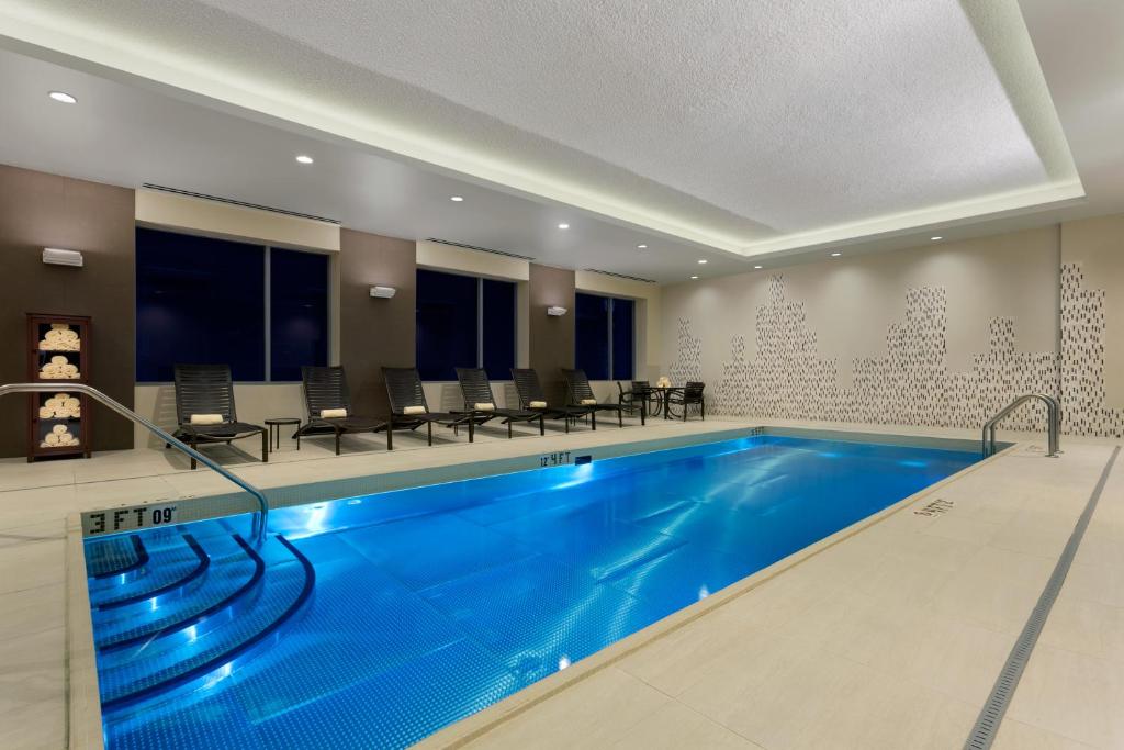 a large swimming pool in a hotel room with a pool at Hyatt Place Chicago/Downtown - The Loop in Chicago
