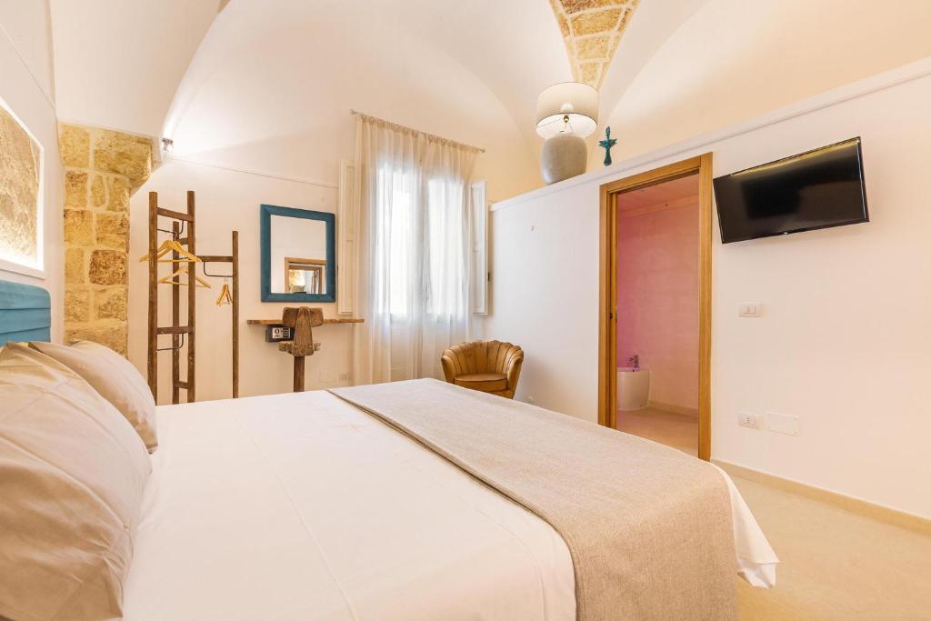 Postel nebo postele na pokoji v ubytování Le Mule Suite and Rooms - Specchia