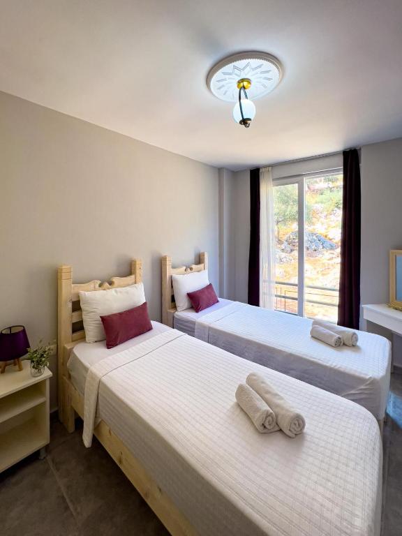 Säng eller sängar i ett rum på Just Dream Suites