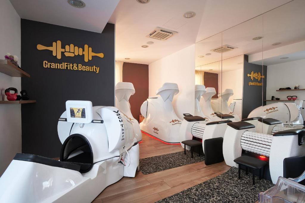 a hair salon with a row of white chairs at Hotel Adria in Dubrovnik