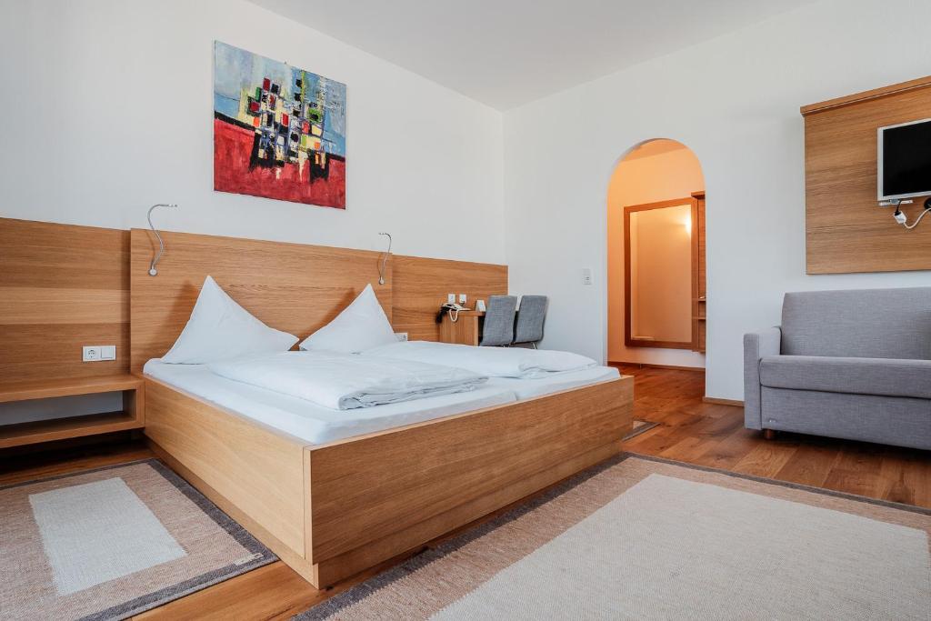 Postel nebo postele na pokoji v ubytování Hotel Vötterl