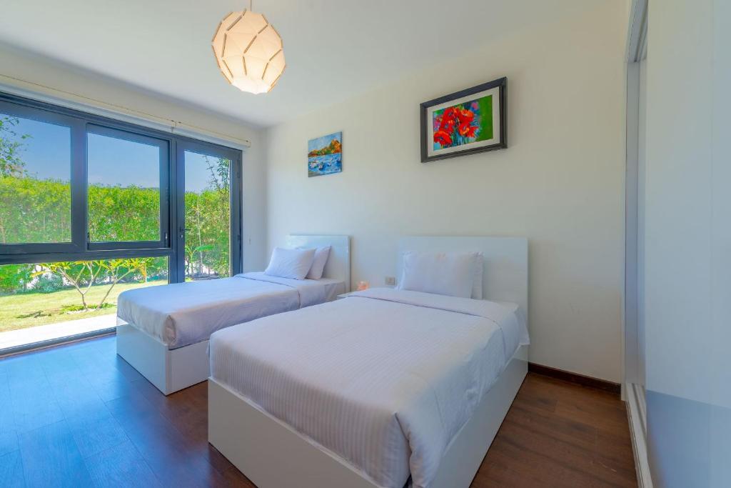 Postel nebo postele na pokoji v ubytování VESTA - Soma Bay Residence