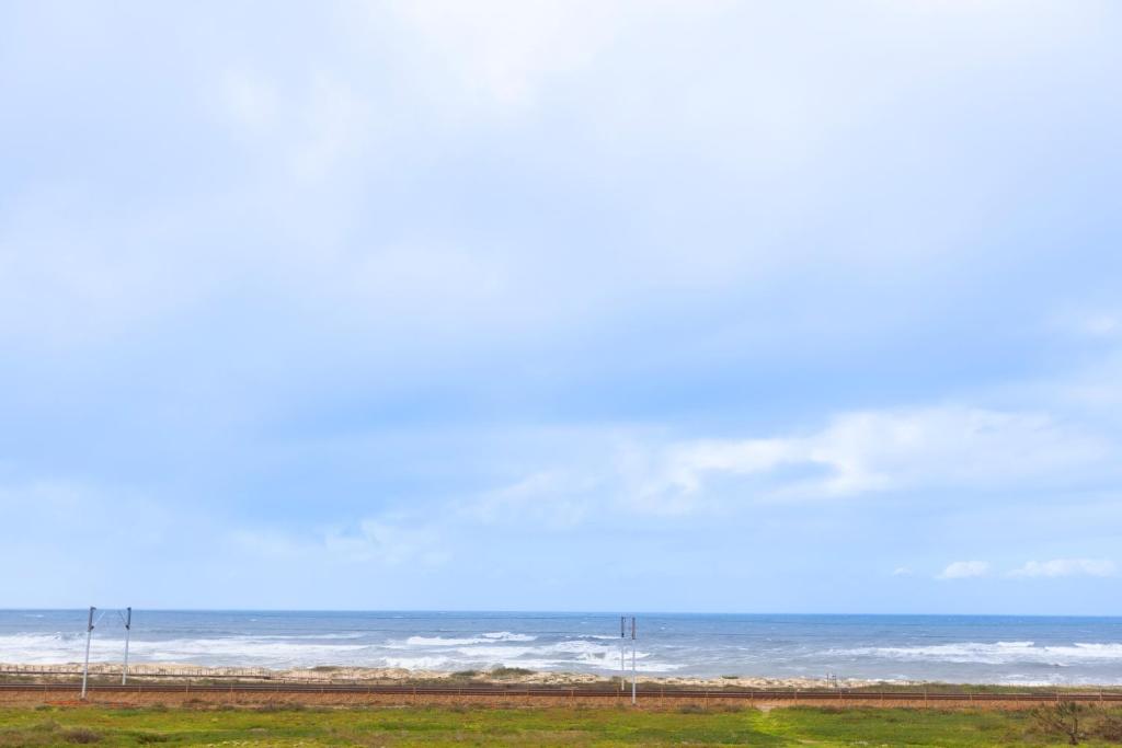 a view of the ocean from the beach at São Félix Seaside Oasis in São Félix da Marinha