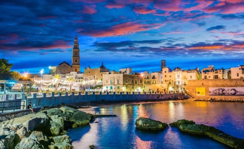 a view of a city at night at Donna Maria Pina in Monopoli