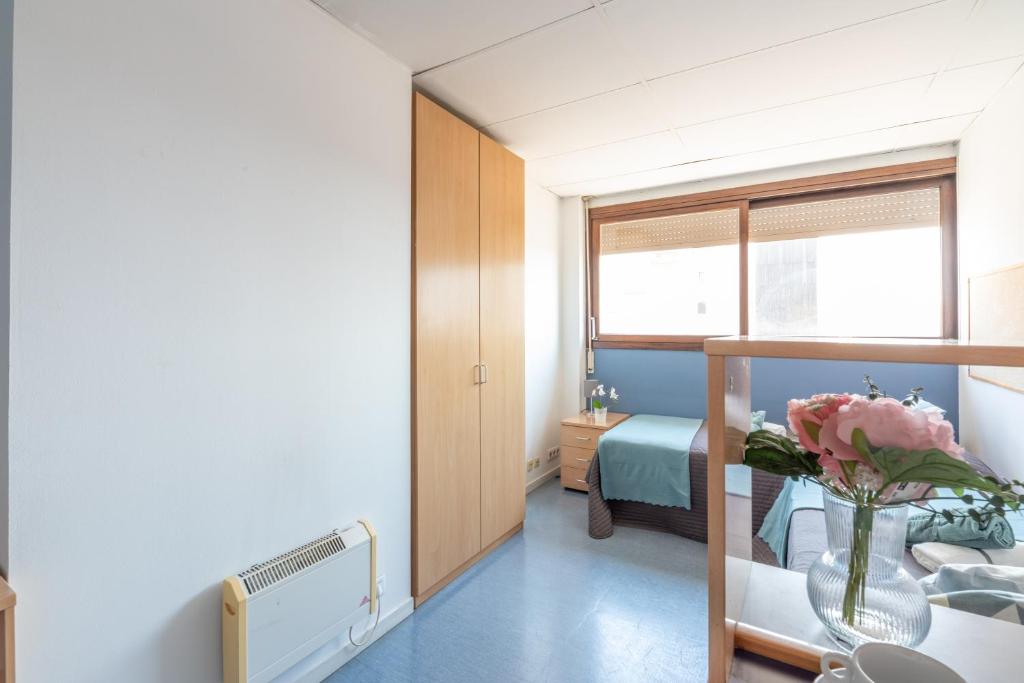 Postel nebo postele na pokoji v ubytování Residencia Universitaria Resa Lesseps
