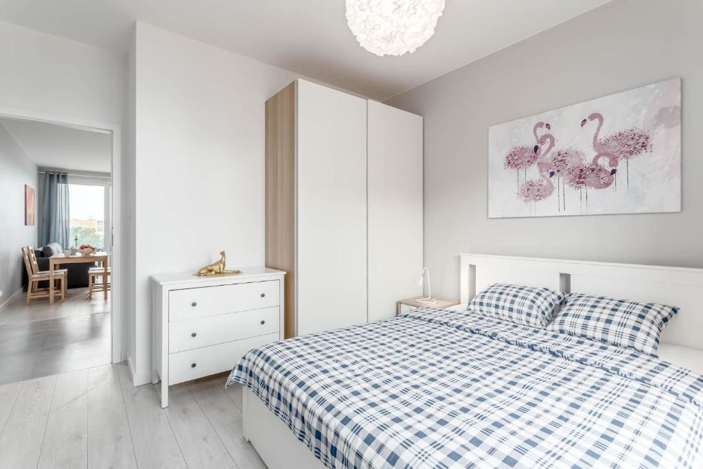 Postel nebo postele na pokoji v ubytování Chill Apartments Ursus