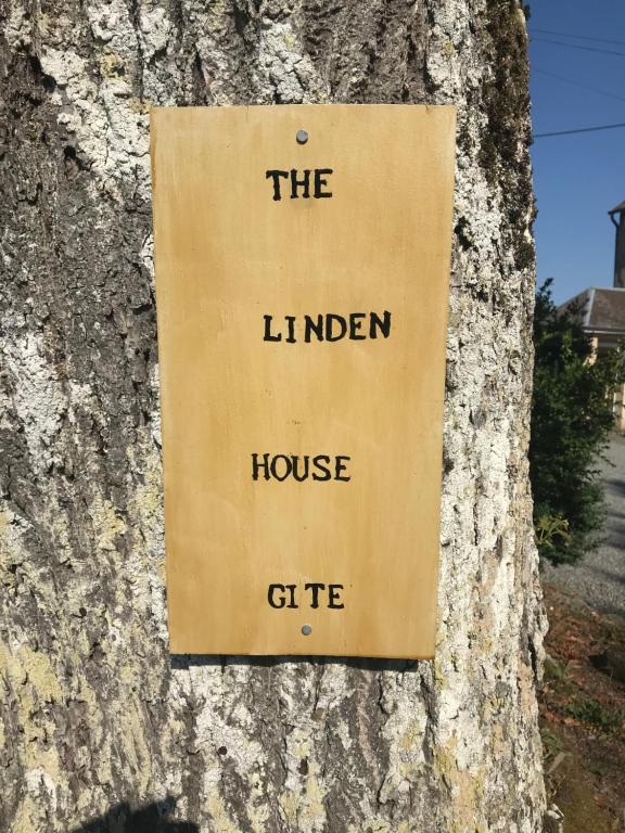 a sign on a tree that reads the linden house gift at The Linden House in Saint-Yrieix-les-Bois