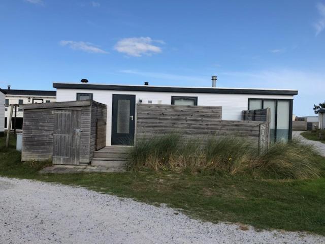 a house with a fence in front of it at Sinne in Ballum