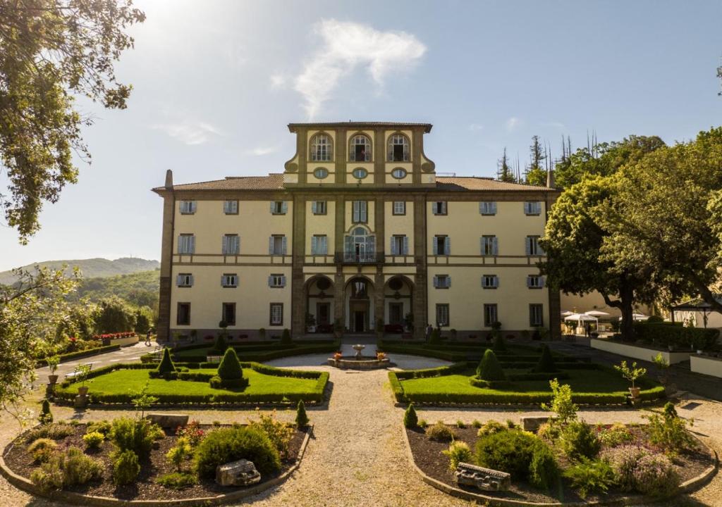 a large building with a garden in front of it at Villa Tuscolana in Frascati