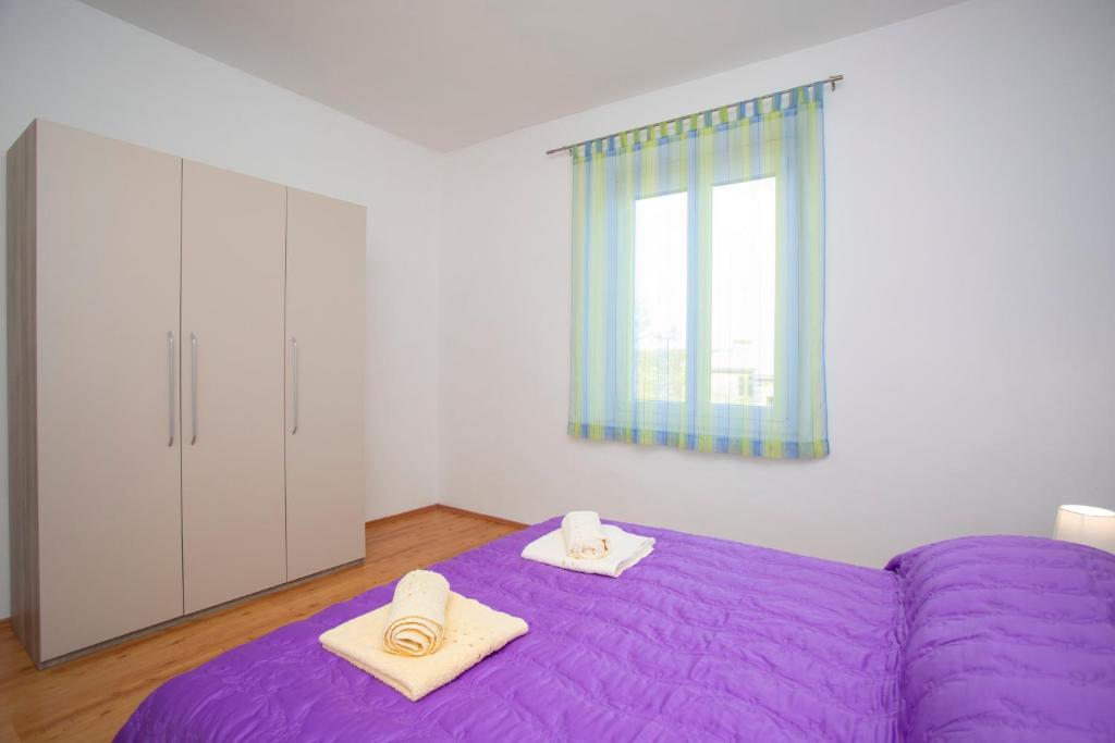 Posteľ alebo postele v izbe v ubytovaní Apartman Lidija Koromačno