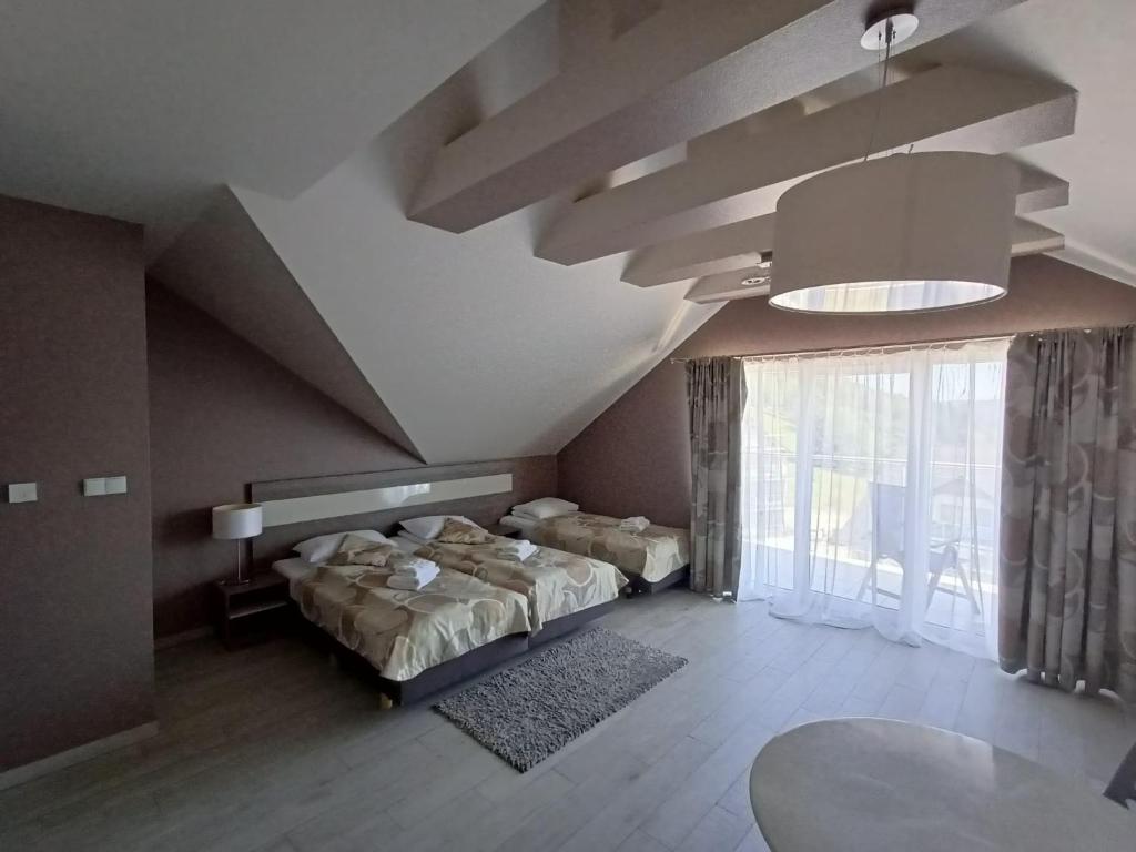 Posteľ alebo postele v izbe v ubytovaní Apartament Tignes Czarna Góra