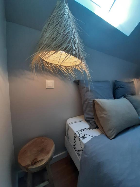Posteľ alebo postele v izbe v ubytovaní Le Cottage du Bois Flotté