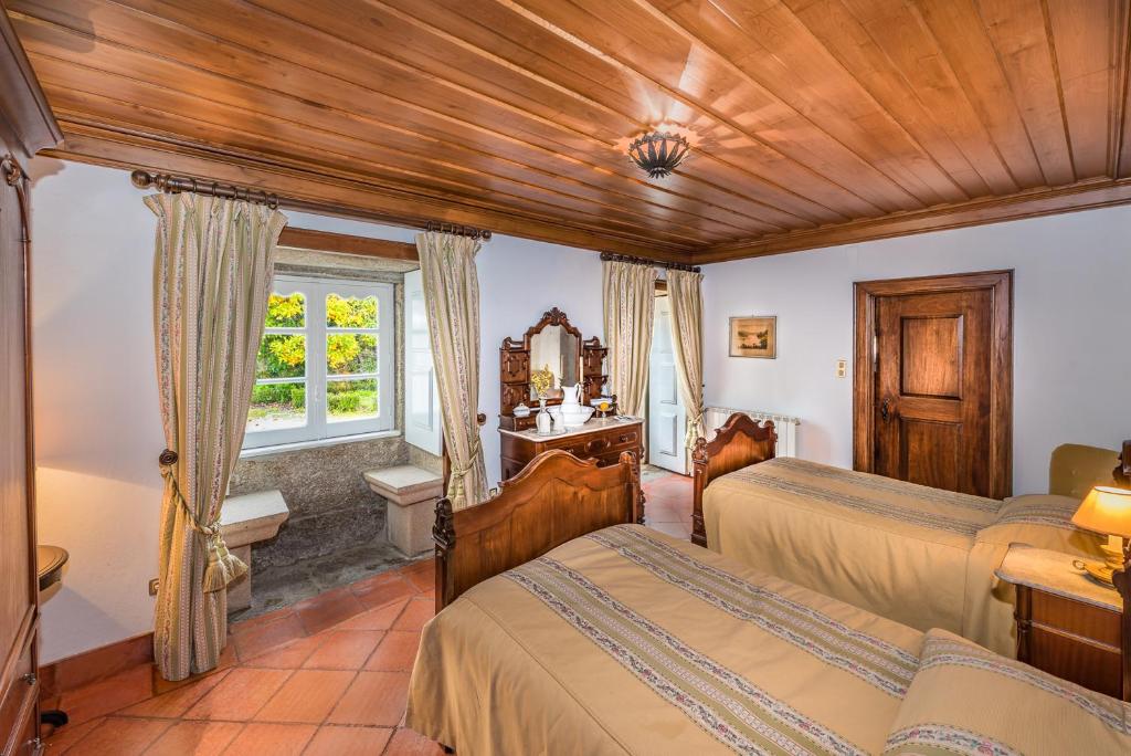 Postel nebo postele na pokoji v ubytování Paço de Calheiros - Turismo de Habitação