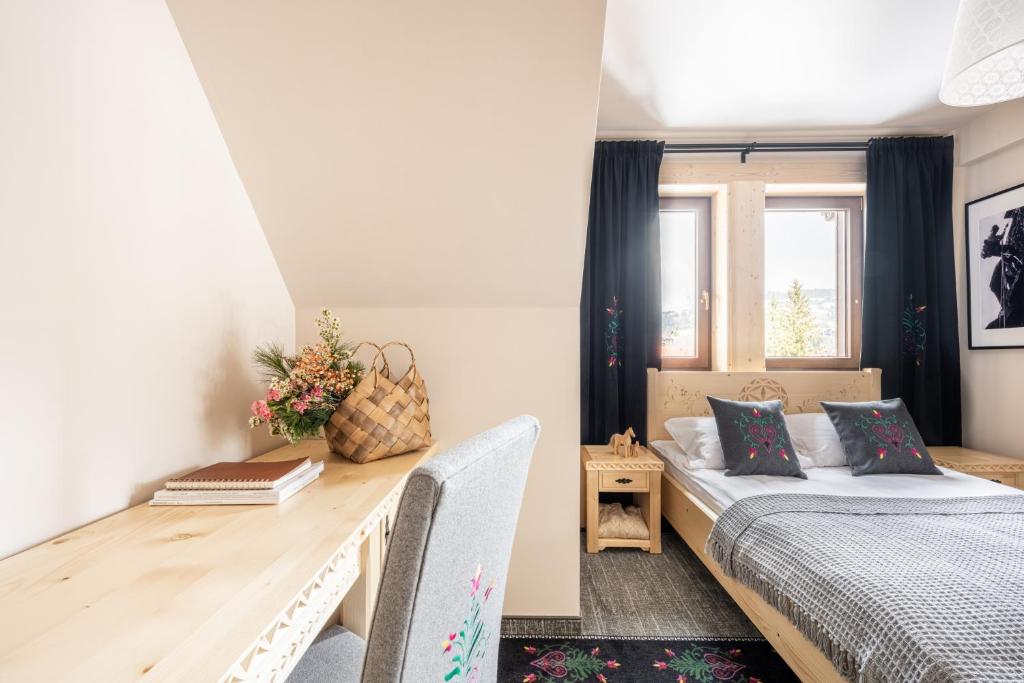 Postel nebo postele na pokoji v ubytování Highlander Heart Residence