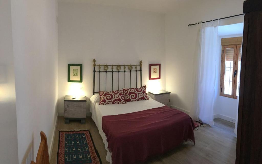 Łóżko lub łóżka w pokoju w obiekcie Casa Montefrio