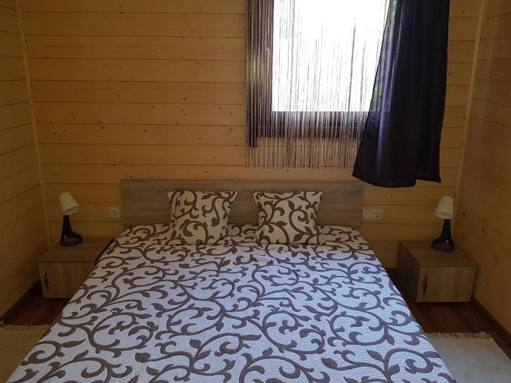 Postel nebo postele na pokoji v ubytování Muskátli Apartman