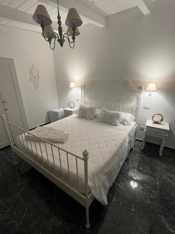 Łóżko lub łóżka w pokoju w obiekcie Supriani Luxury B&B