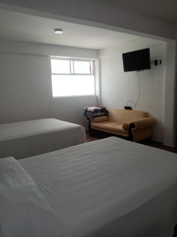 Postel nebo postele na pokoji v ubytování Hotel Cipreses