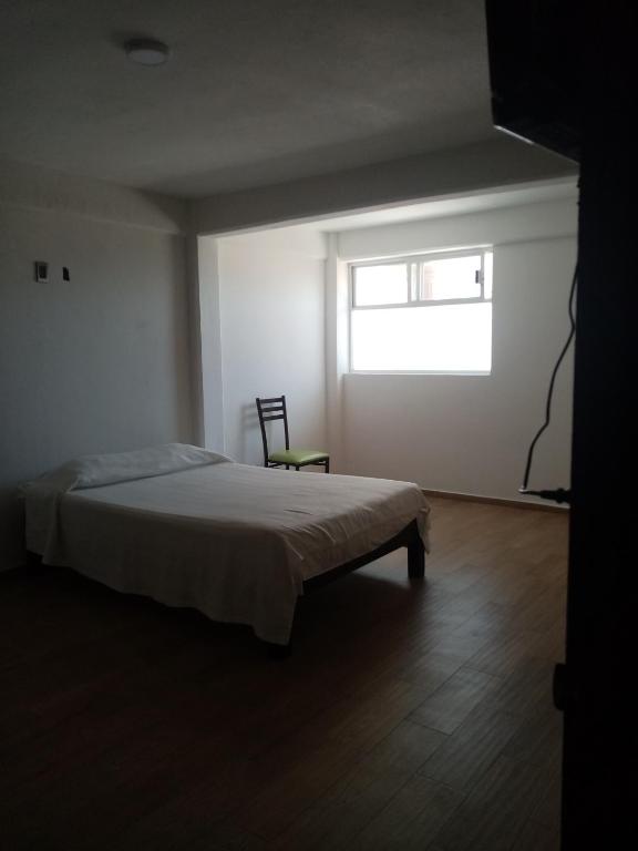 Postel nebo postele na pokoji v ubytování Hotel Cipreses