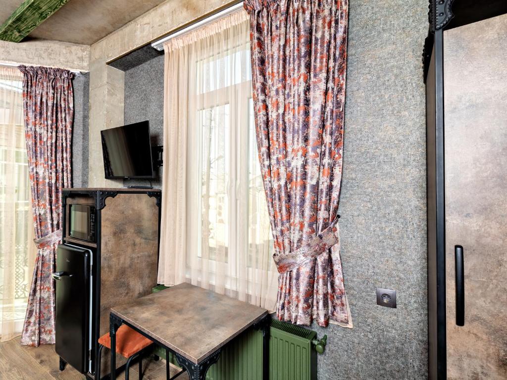TV a/nebo společenská místnost v ubytování 6 Unique Apartments