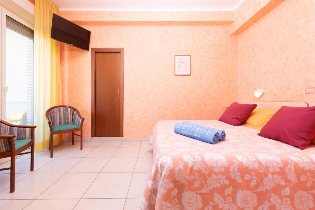 Postel nebo postele na pokoji v ubytování Hotel Caesar