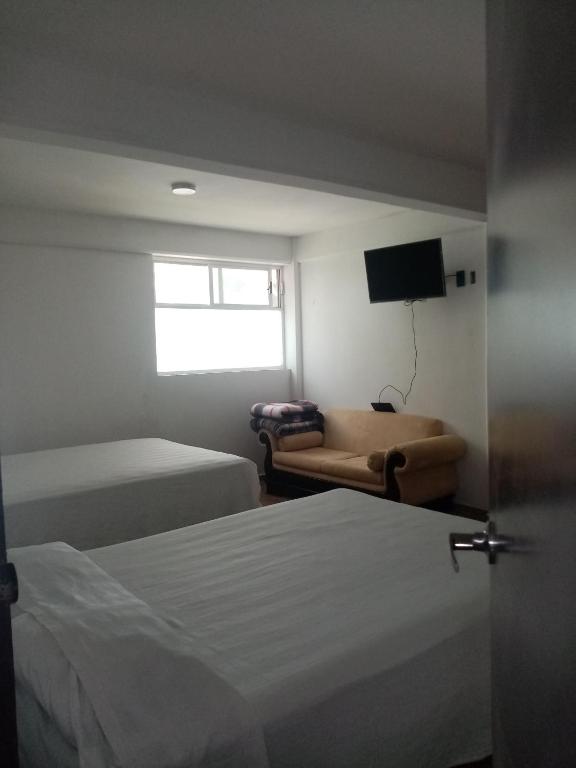 Postel nebo postele na pokoji v ubytování Hotel Cipreses